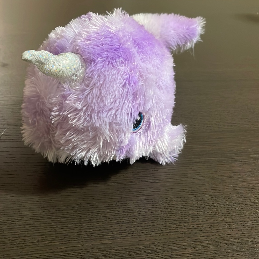Purple and white narwhal stuffed animal